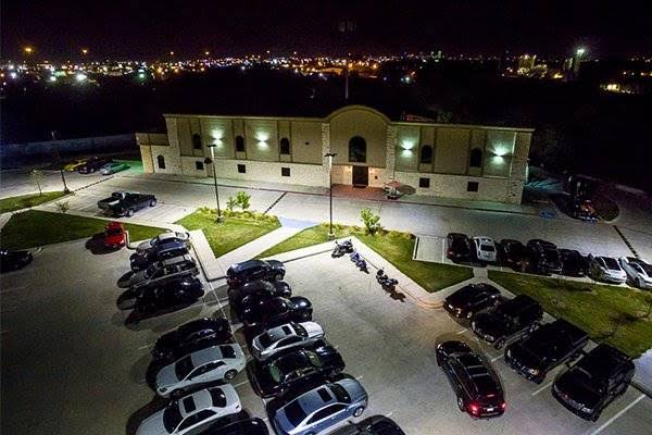 Aerial nighttime view of Bucks Wild Houston and its illuminated parking lot